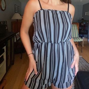 Vertical black and white striped romper